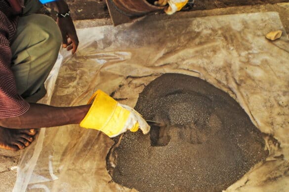 Image of miner checking processed coltan ore in the Democratic Republic of Congo
