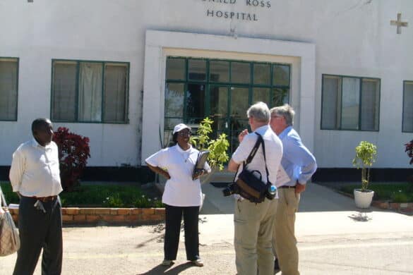 Entrance to the Ronald Ross General Hospital, Mufulira, 31 March-8 April 2022. On the far right is late Dr Tony Simmonds who was instrumental in creating the first medical links for Friends of Mufulira charity