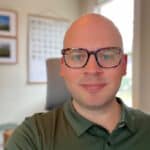 Head and shoulders photo of John Porter against an office interior background