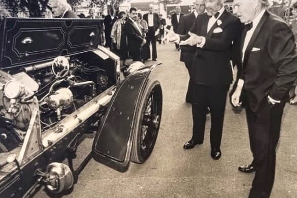 A black and white photo of Trevor Tarring with his 1908 Napier car with Prince Michael of Kent Image featuring vintage car, men talking