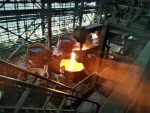 Interior view of the Nikopol Ferroalloys Plant showing a ladle furnace pouring out molten metal. Image © Polina Sparks, MMTA