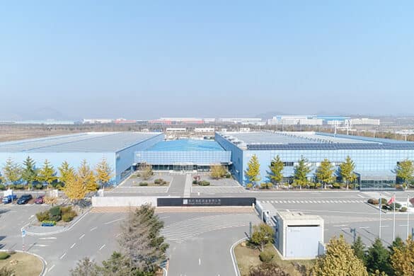 Offices of Dalian Rongke Power, which has commissioned the largest vanadium redox flow battery for energy storage in operation. Featuring building, sky, road, trees