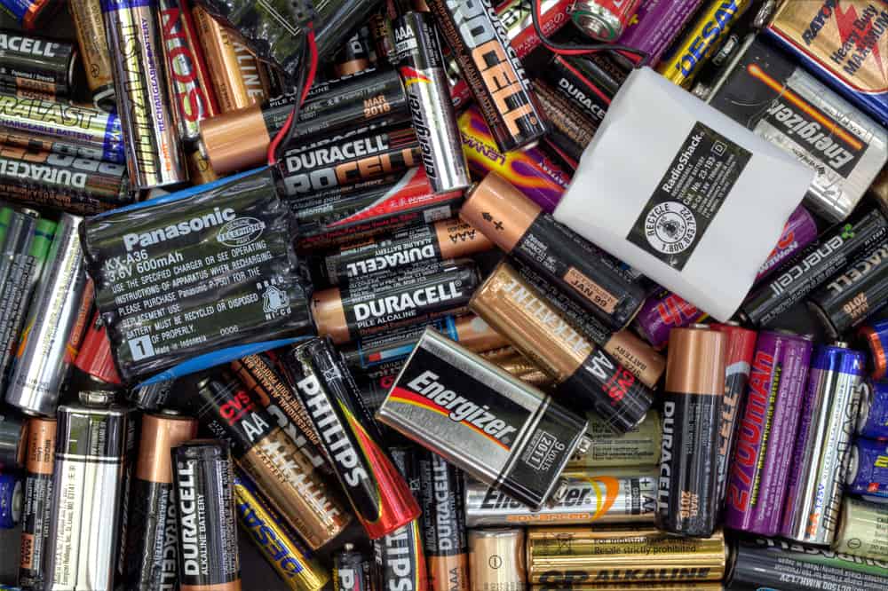 Image of mixed used batteries of different shapes and sizes
