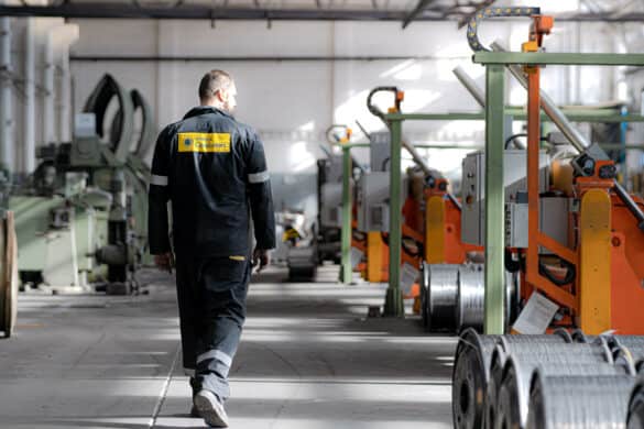 Photo of a worker walking through a Heneken Group factory