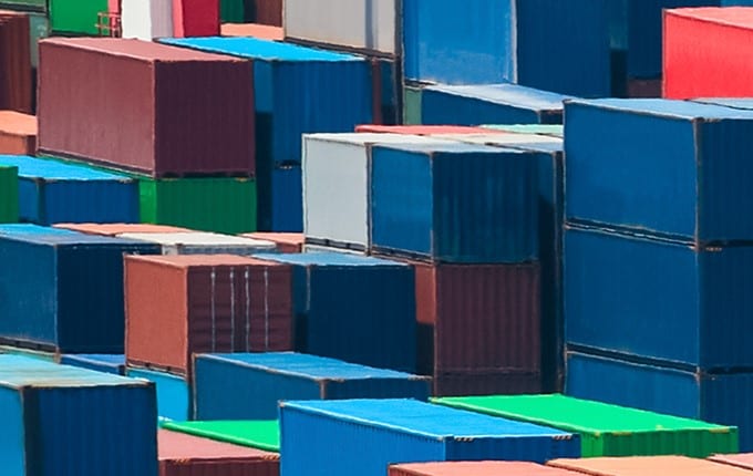 Shipping containers, image by chuyuss at Shuttlestock