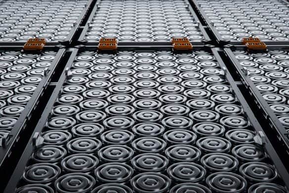 Close-up of Li-ion high-capacity cells stacked inside EV battery modules. IM Images, at Shutterstock