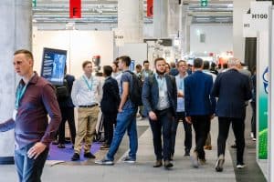 Delegates walking through the Metal Recycling Expo exhibition hall in messe Frankfurt