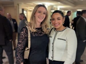 Freya Kerwin, MMTA managing director, a young woman with long blonde hard wearing a black lace-sleeved top and Rae Boyadjis 
Fastmarkets reporter, a young woman with pinned back dark hair, wearing a white jacket, at the joined round table event in New York. 