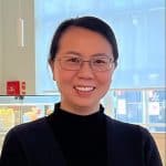 Mandy Yin, a woman with dark hair and wire rimmed glasses
