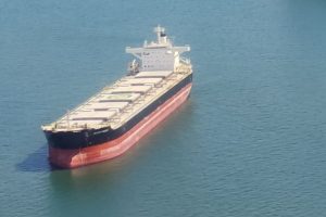 An unloaded container vessel on the water.